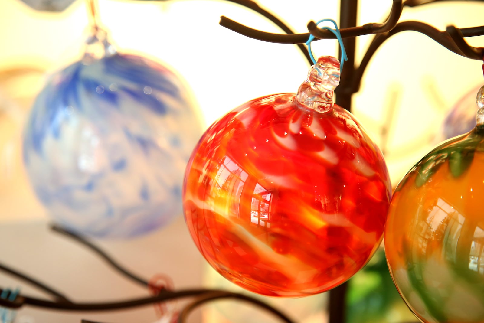 The Contemporary Daytonâs Annual Holiday Gift Gallery begins Nov. 14. More than 70 local and regional artists have created original, fine art pieces perfect for holiday gifts. Dennis Walker has created colorful glass ornaments.  LISA POWELL / STAFF