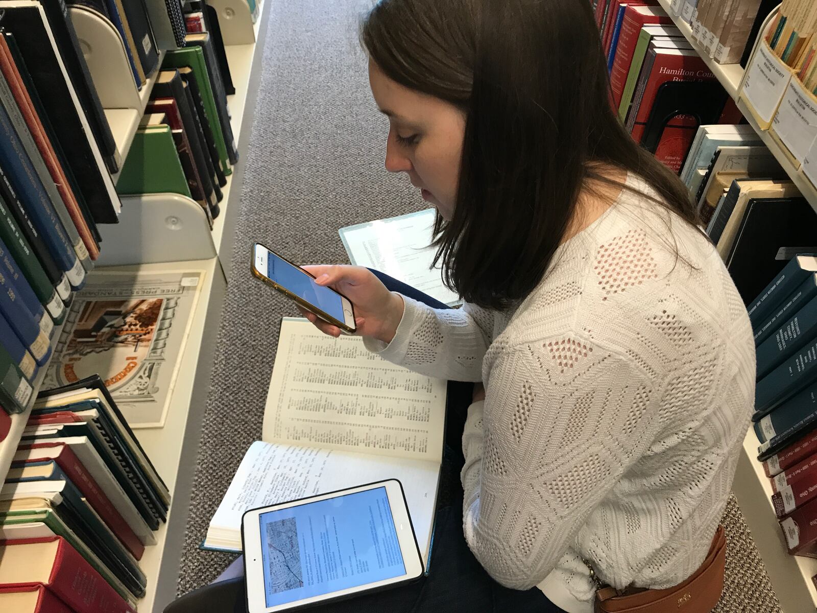 On and off over two year, George Drake  Jr. lead a team that includes his wife, Ruth Reveal, and a farmer named Jessi Sievers on a quest to piece together the real-life story behind a letter found under an Oakwood bathtub. The result if the podcast Fifth and Ludlow. Ruth Reveal is pictured at Ohio Genealogical Society.