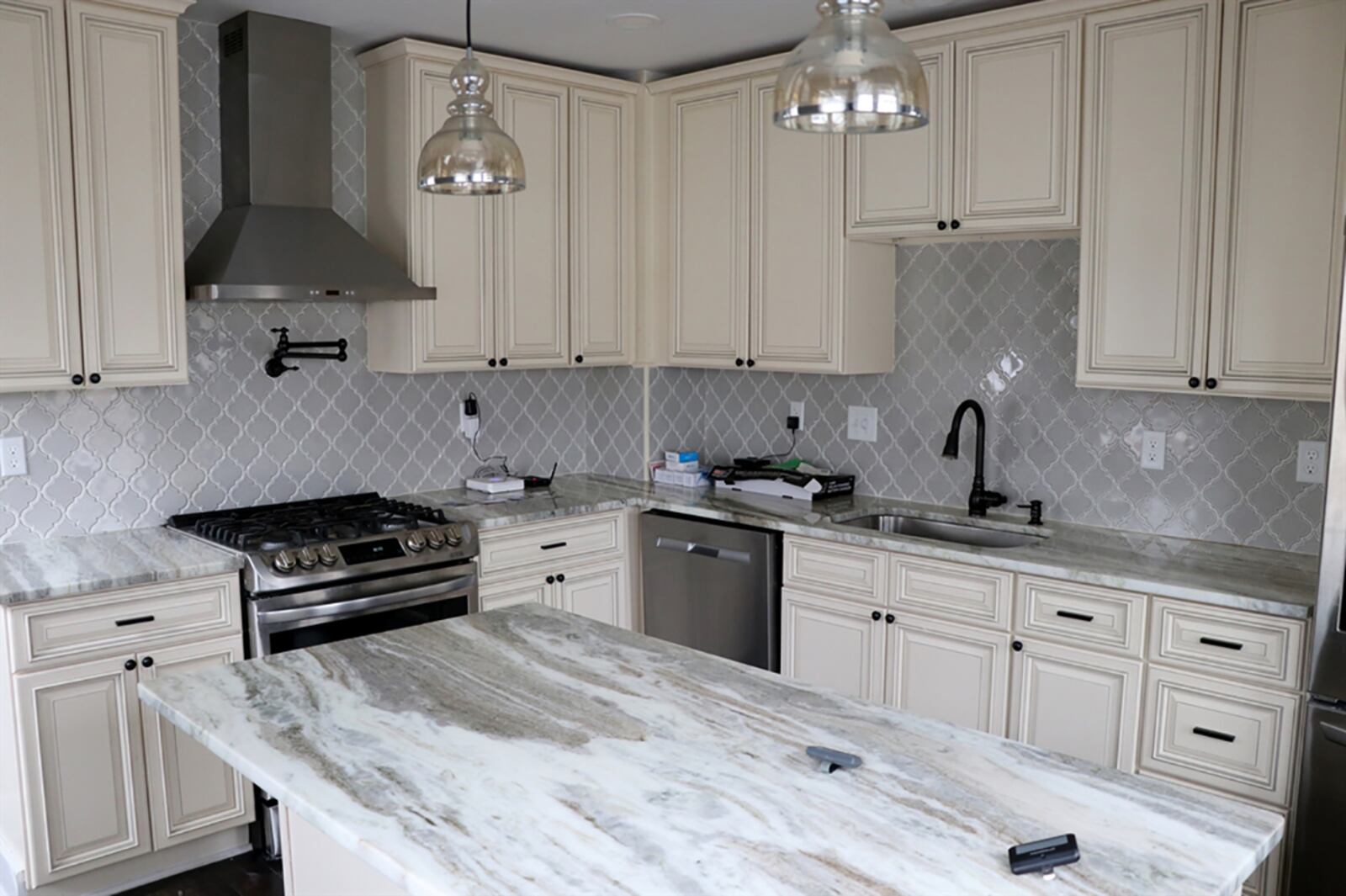 A completely renovated kitchen offers 42-inch antique white cabinetry along two walls. Complementing granite countertops offer plenty of workspace. CONTRIBUTED PHOTO BY KATHY TYLER