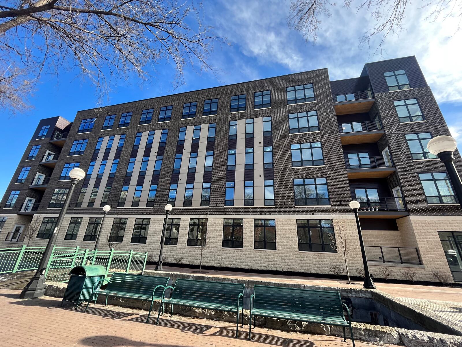 The Sutton apartment building at 307 East First St. in the Water Street District in downtown Dayton. The apartments are on the same block as Day Air Ballpark, where the Dayton Dragons play minor league baseball. CORNELIUS FROLIK / STAFF