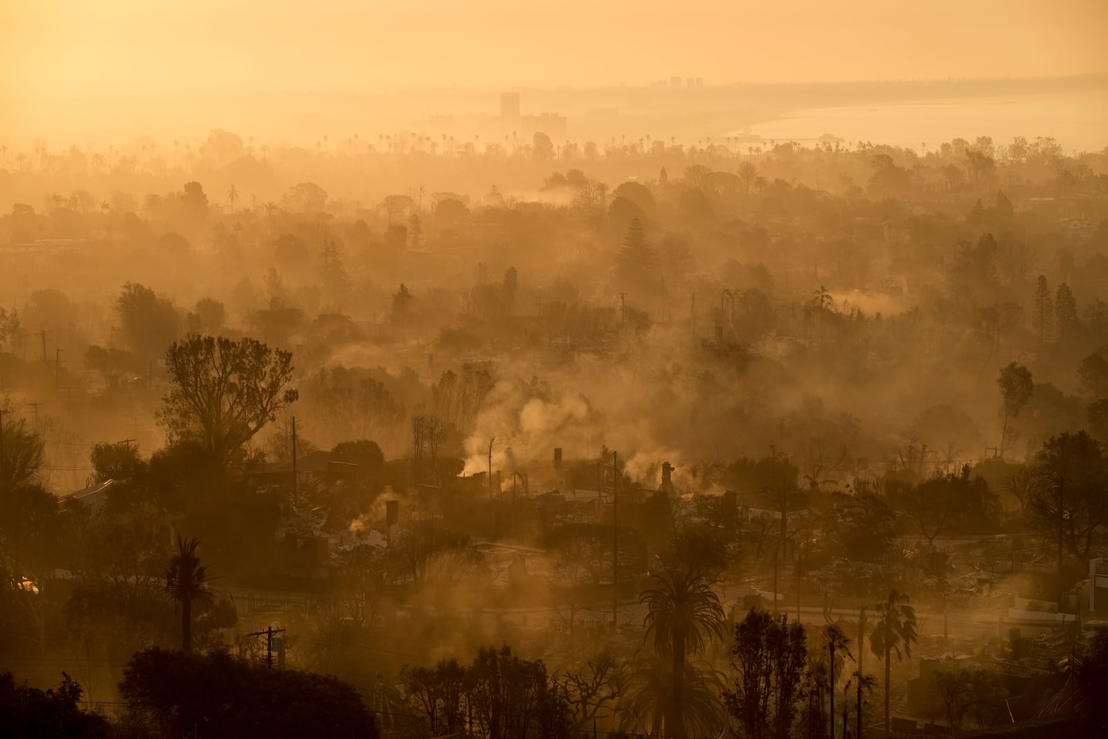 The devastation of the Palisades Fire is seen in the early morning in the Pacific Palisades neighborhood of Los Angeles, Friday, Jan. 10, 2025. (AP Photo/John Locher)