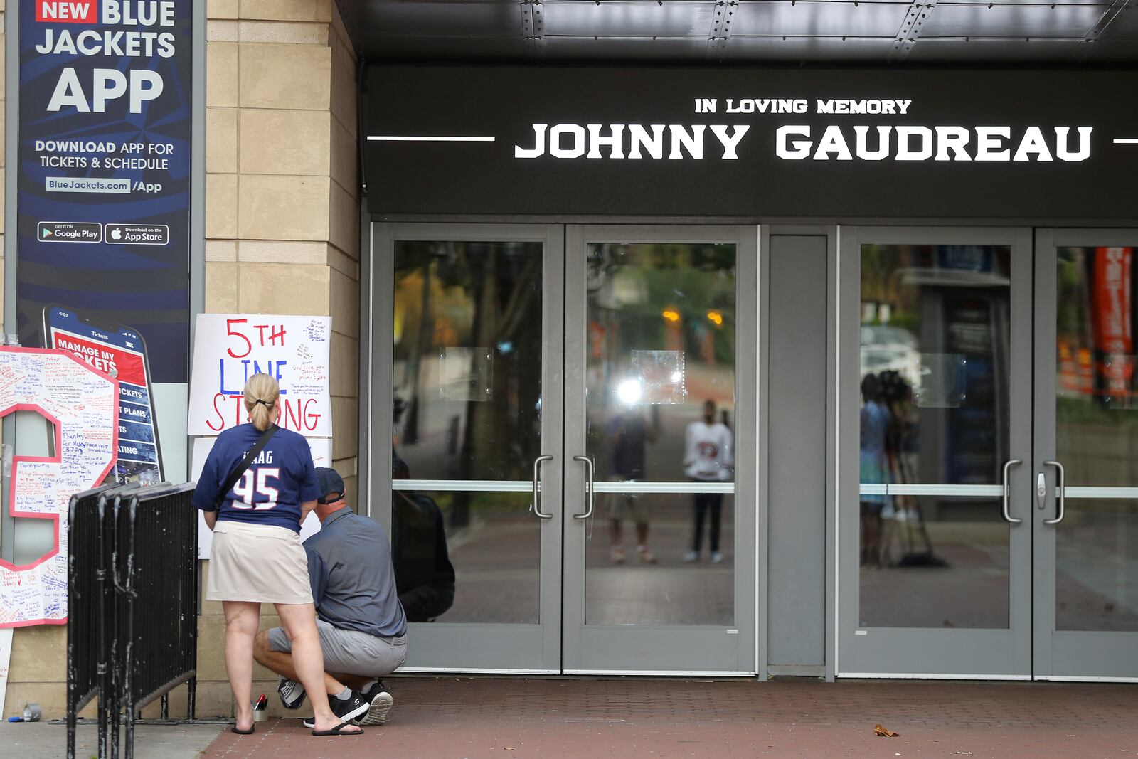 FILE - The view outside of Nationwide Arena at a memorial set up by fans for Blue Jackets hockey player Johnny Gaudreau in Columbus, Ohio, Aug. 30, 2024. (AP Photo/Joe Maiorana, file)