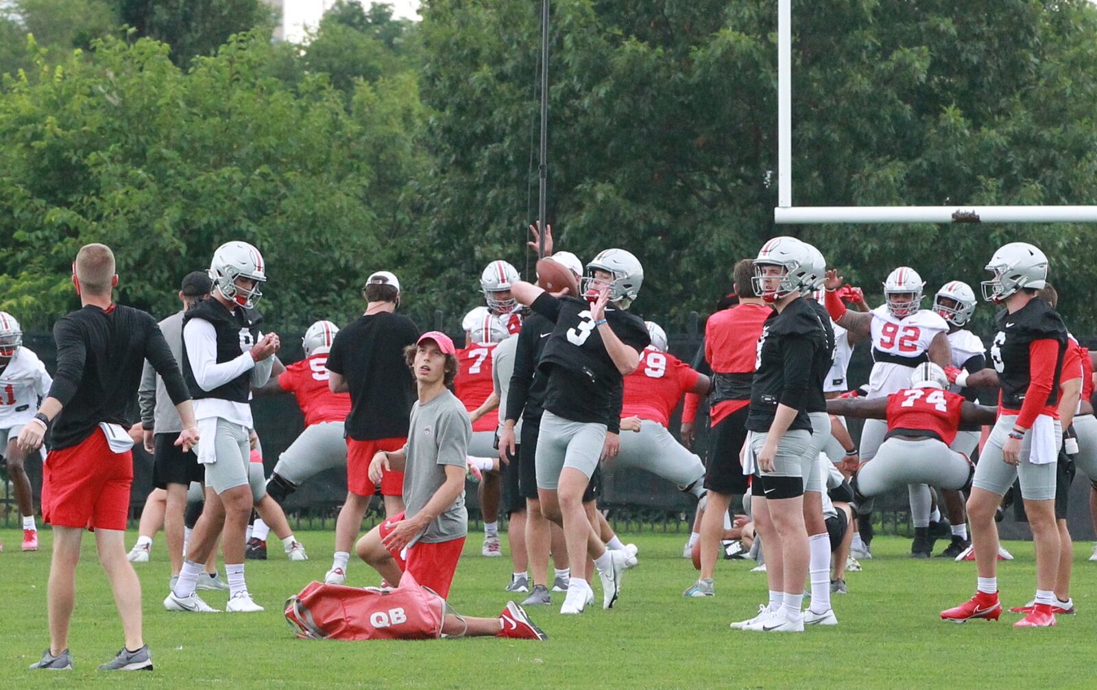 Quinn Ewers throws a pass at Ohio State Buckeyes football practice.