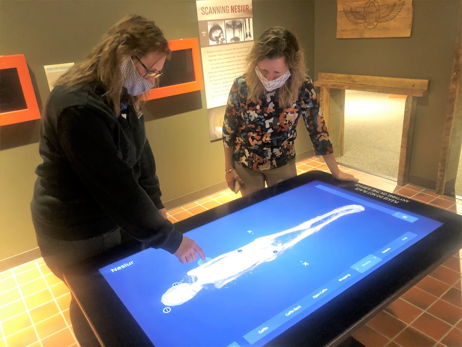 The Boonshoft Museum of Discovery closed to the public on May 15.   Tracey Tomme ,  president and CEO of Dayton Society of Natural History,  with Jill Krieg-Accrocco, curator of anthropology and exhibitions, at an interactive display about Nesiur, whose mummified remains are in the museums.