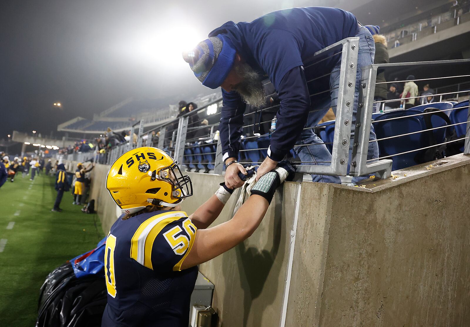 Andy Howe talks to his son, Springfield's Jerome Howe, after Springfield lost to St. Eds in the State Finals Friday, Dec. 1, 2023. BILL LACKEY/STAFF