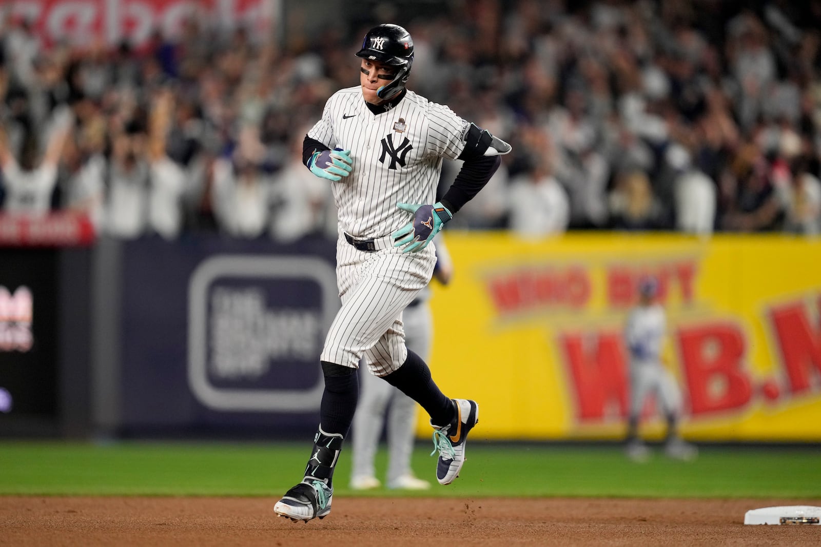 New York Yankees' Aaron Judge rounds the bases after a two-run home run against the Los Angeles Dodgers during the first inning in Game 5 of the baseball World Series, Wednesday, Oct. 30, 2024, in New York. (AP Photo/Ashley Landis)