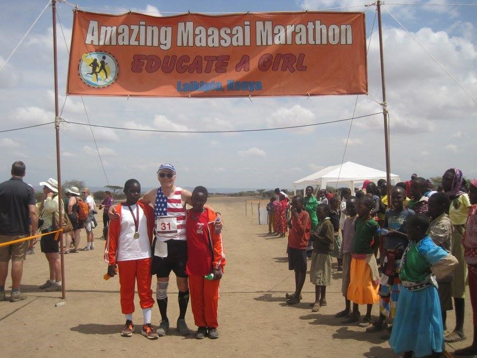 Bob Welbaum with two Maasai girls after Amazing Maasai Marathon in Kenya. CONTRIBUTED