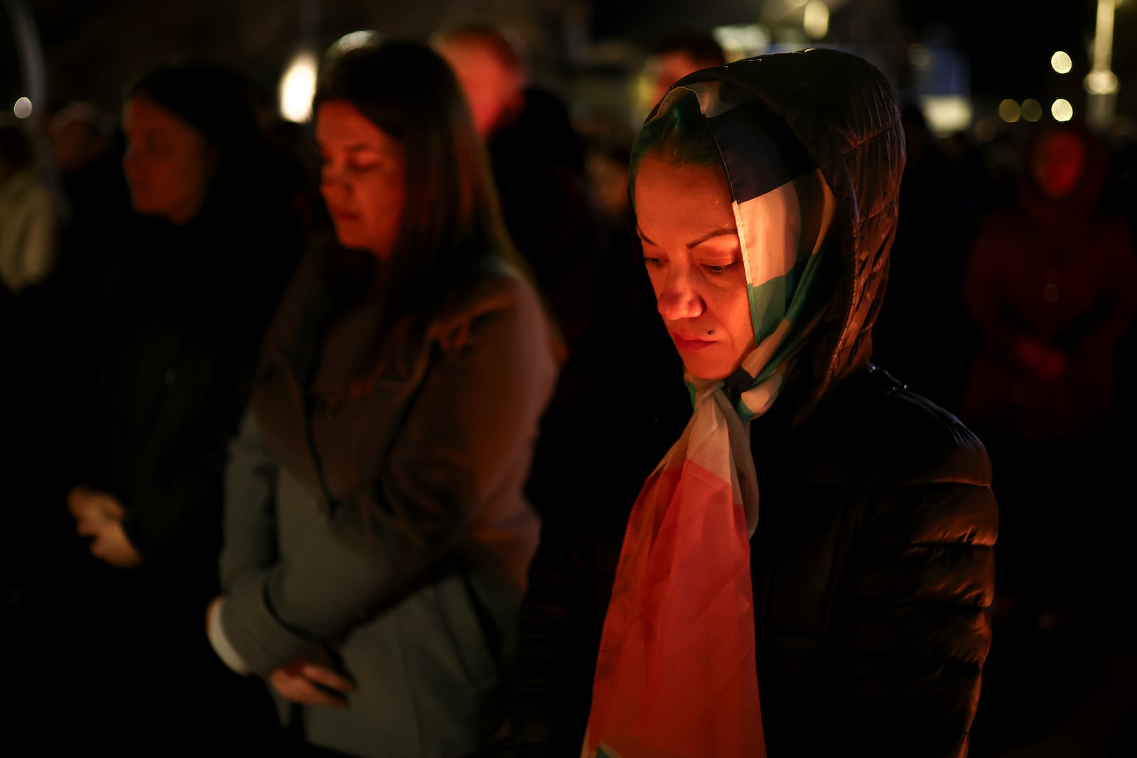 People attend a vigil in the town of Kocani, North Macedonia, Tuesday, March 18, 2025 following a massive fire in a nightclub early Sunday. (AP Photo/Armin Durgut)