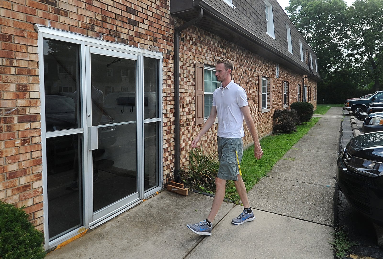 Joseph Tyre walks into his apartment building Friday, July 28, 2023. Tyre and his wife rented an apartment in Miamisburg after repeated attempts to buy a home didn't work out in a very tight housing market. MARSHALL GORBY\STAFF