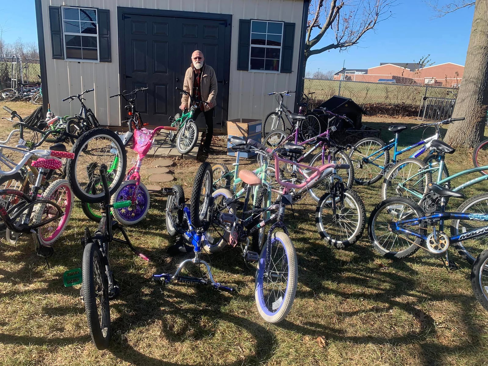 David Nugent with a few of the bikes he has repaired and that are ready for children to ride.