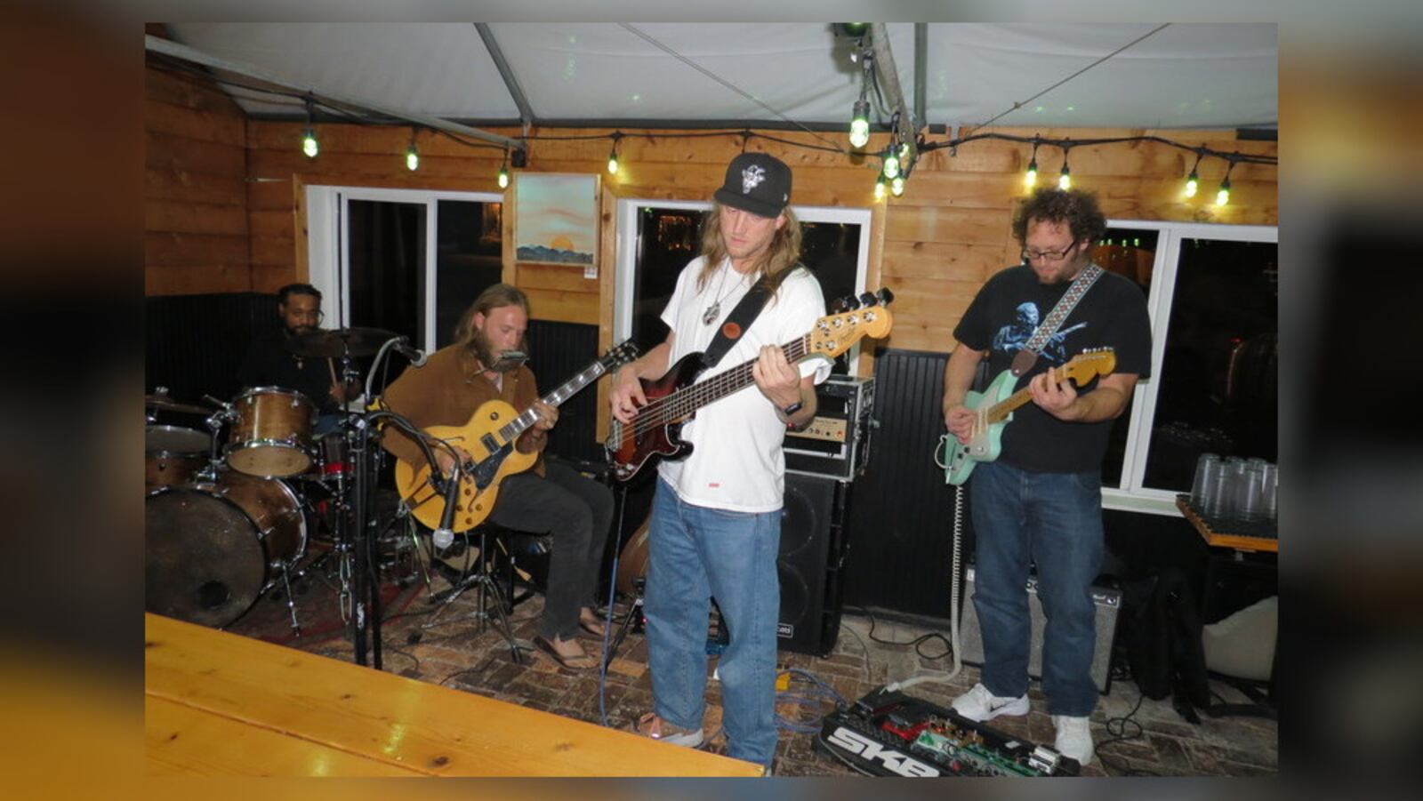 Joe Waters (sitting), who won the Telluride Blues Challenge in Colorado in September, performing with his Back Porch Band, (left to right) Saxtone Arrington, Craig Rockland and Casey Ott, performing at Trail Town Brewing in Yellow Springs. CONTRIBUTED