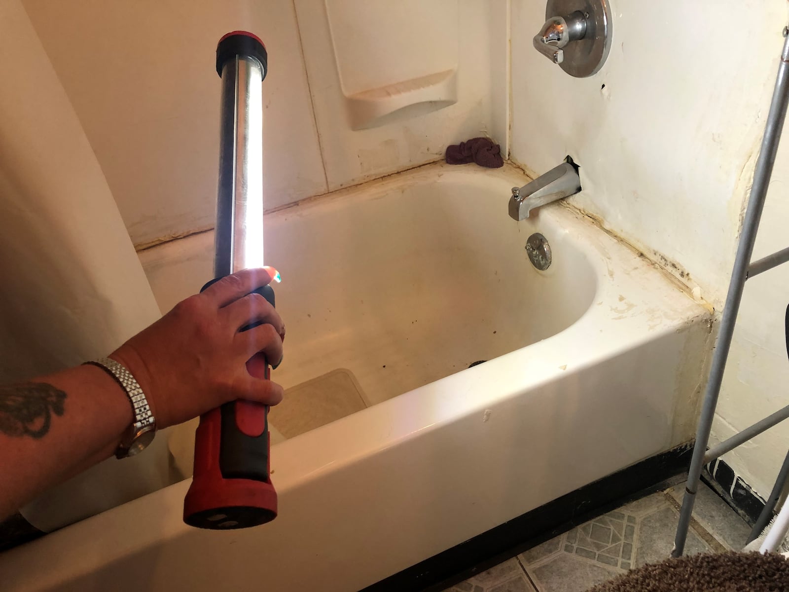 Dawn Manz, 46, says her bathroom has black mold and her sink can't be used. CORNELIUS FROLIK / STAFF