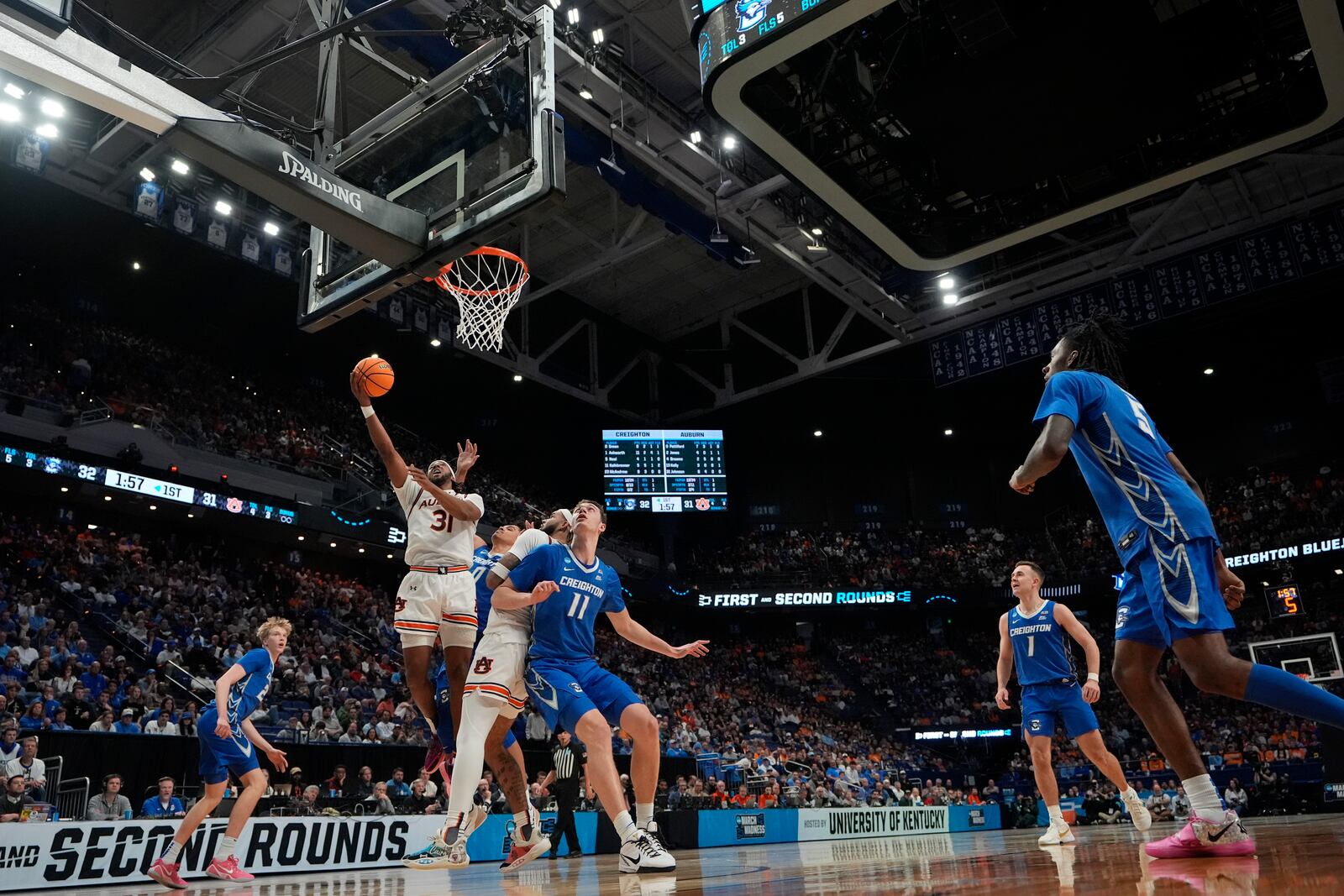 Auburn forward Chaney Johnson (31) shoots the ball during the first half in the second round of the NCAA college basketball tournament against Creighton, Saturday, March 22, 2025, in Lexington, Ky. (AP Photo/Brynn Anderson)