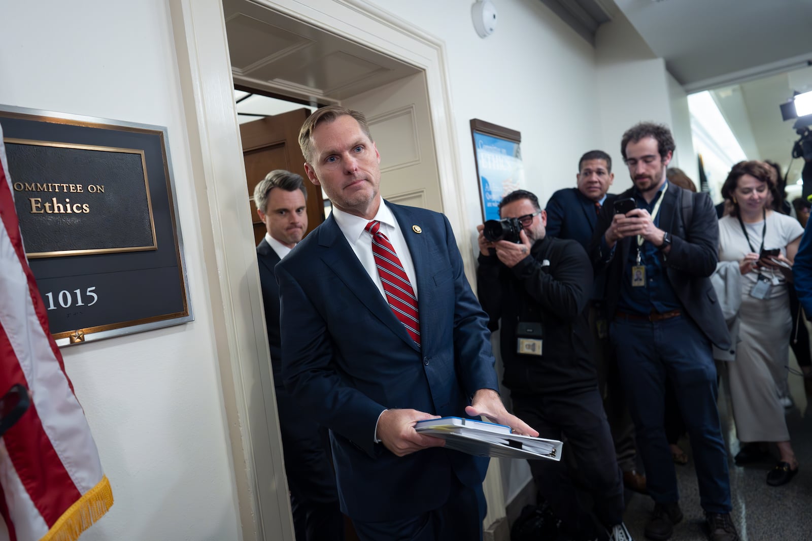 The House Ethics Committee Chairman Michael Guest, R-Miss., rushes past reporters without speaking after his panel met to consider the investigation of former Rep. Matt Gaetz, R-Fla., President-elect Donald Trump's choice to be attorney general, at the Capitol in Washington, Wednesday, Nov. 20, 2024. (AP Photo/J. Scott Applewhite)