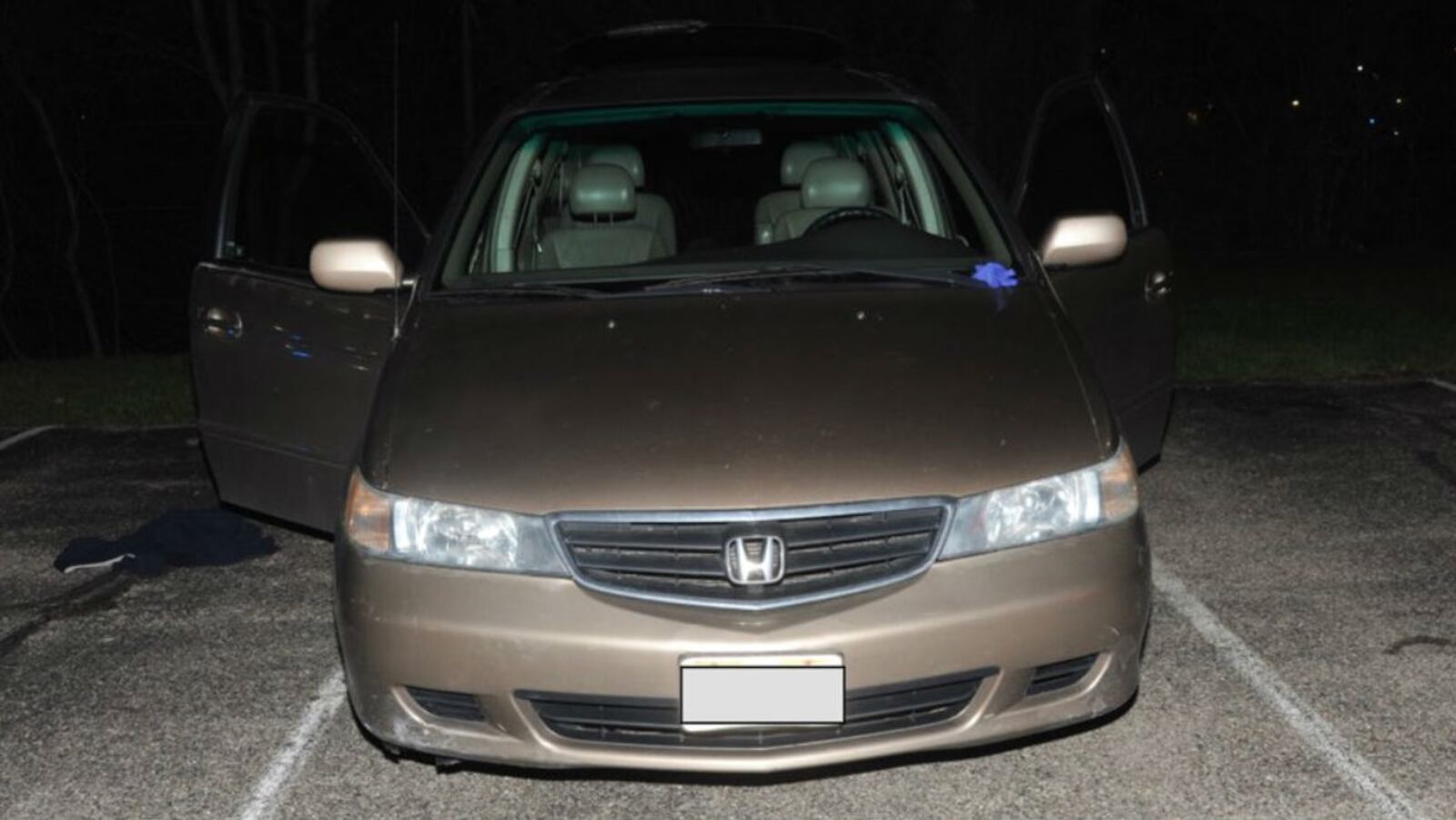 A police photo shows the minivan that Jacob Plush, 16, of Cincinnati, died in parked in a student parking lot at Seven Hills School Tuesday, April 10, 2018. Plush, a sophomore at the school, was crushed to death by a seat in the van. His father found his body about six hours after the teen made two 911 calls begging for help.