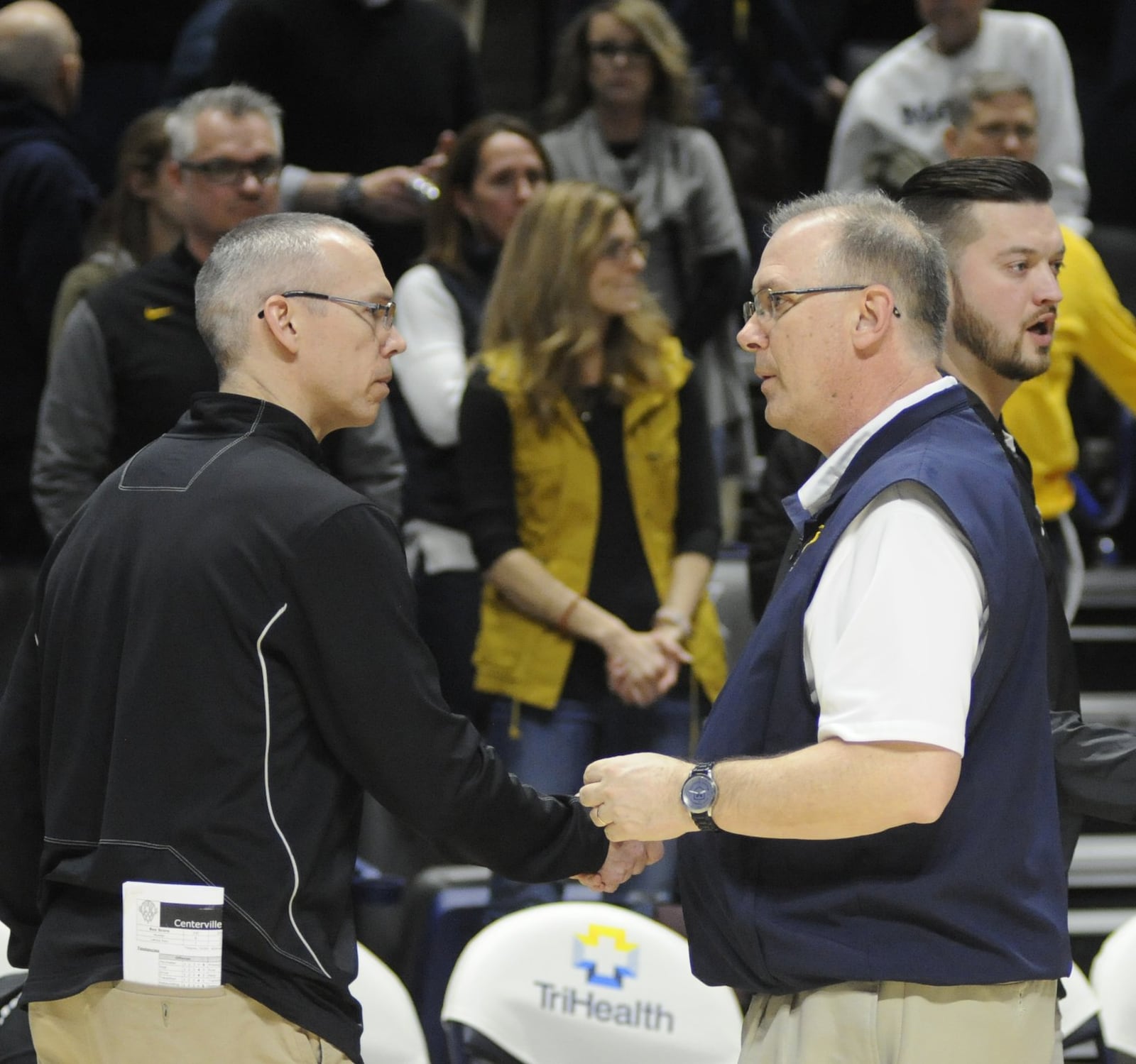 Centerville coach Brook Cupps and Moeller coach Carl Kremer. Moeller defeated Centerville 59-41 in a boys high school basketball D-I regional final at Xavier University’s Cintas Center on Saturday, March 16, 2019. MARC PENDLETON / STAFF