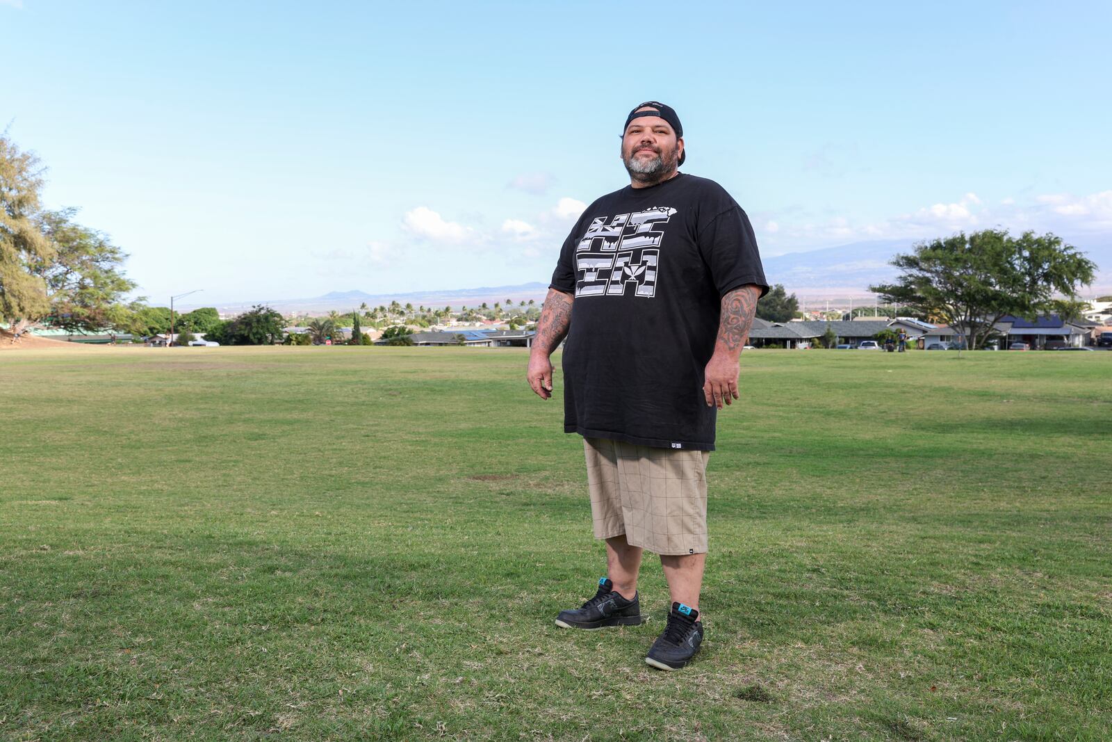 Joshua Kamalo, 43, is seen at a local park, Wednesday, Dec. 18, 2024, in Kahului, Hawaii. (AP Photo/Marco Garcia)