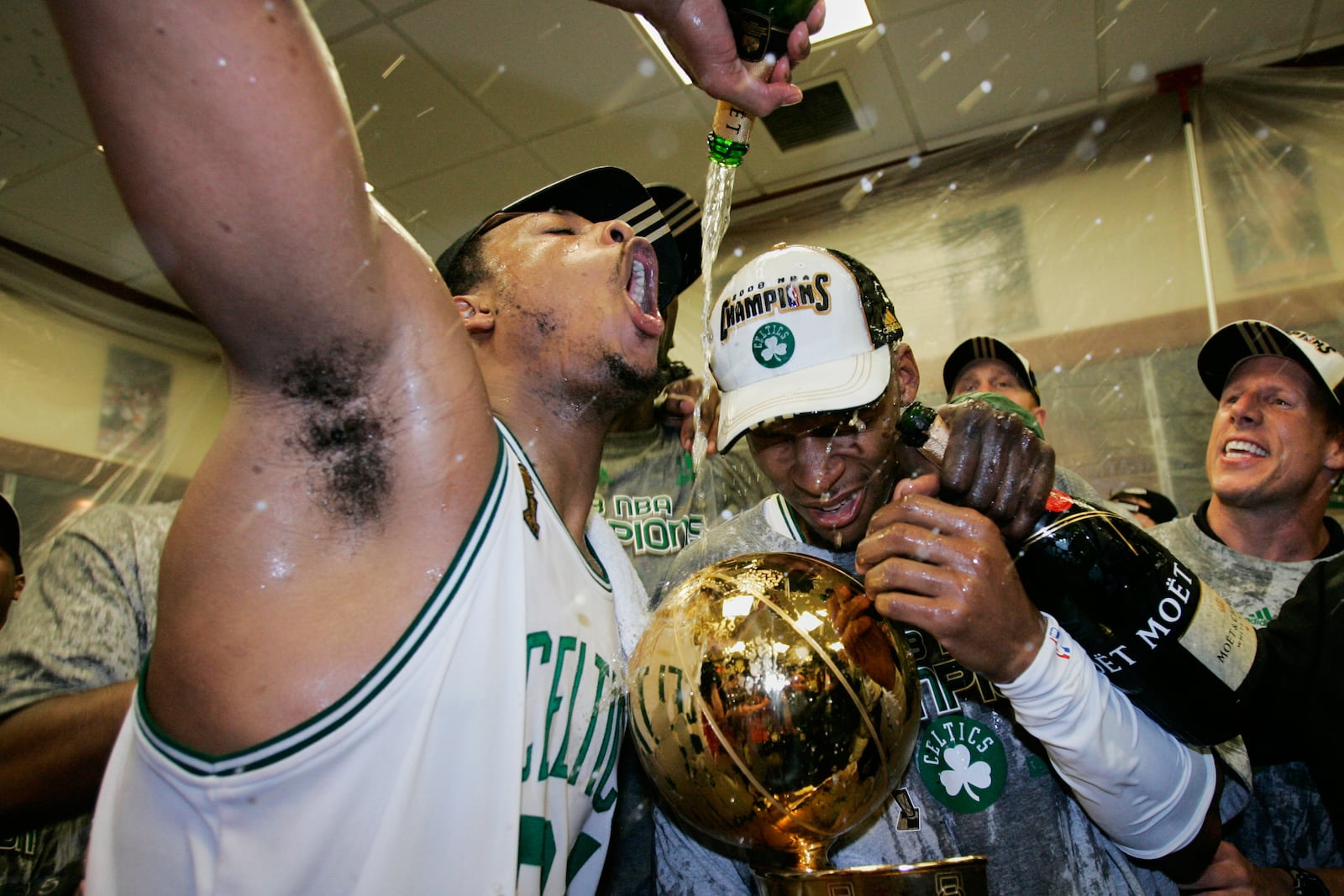 FILE - Boston Celtics' Paul Pierce, left, and Ray Allen celebrate in the locker room after winning Game 6 of the NBA Finals over the Los Angeles Lakers to win the championship Tuesday, June 17, 2008, in Boston. (AP Photo/Winslow Townson, File)