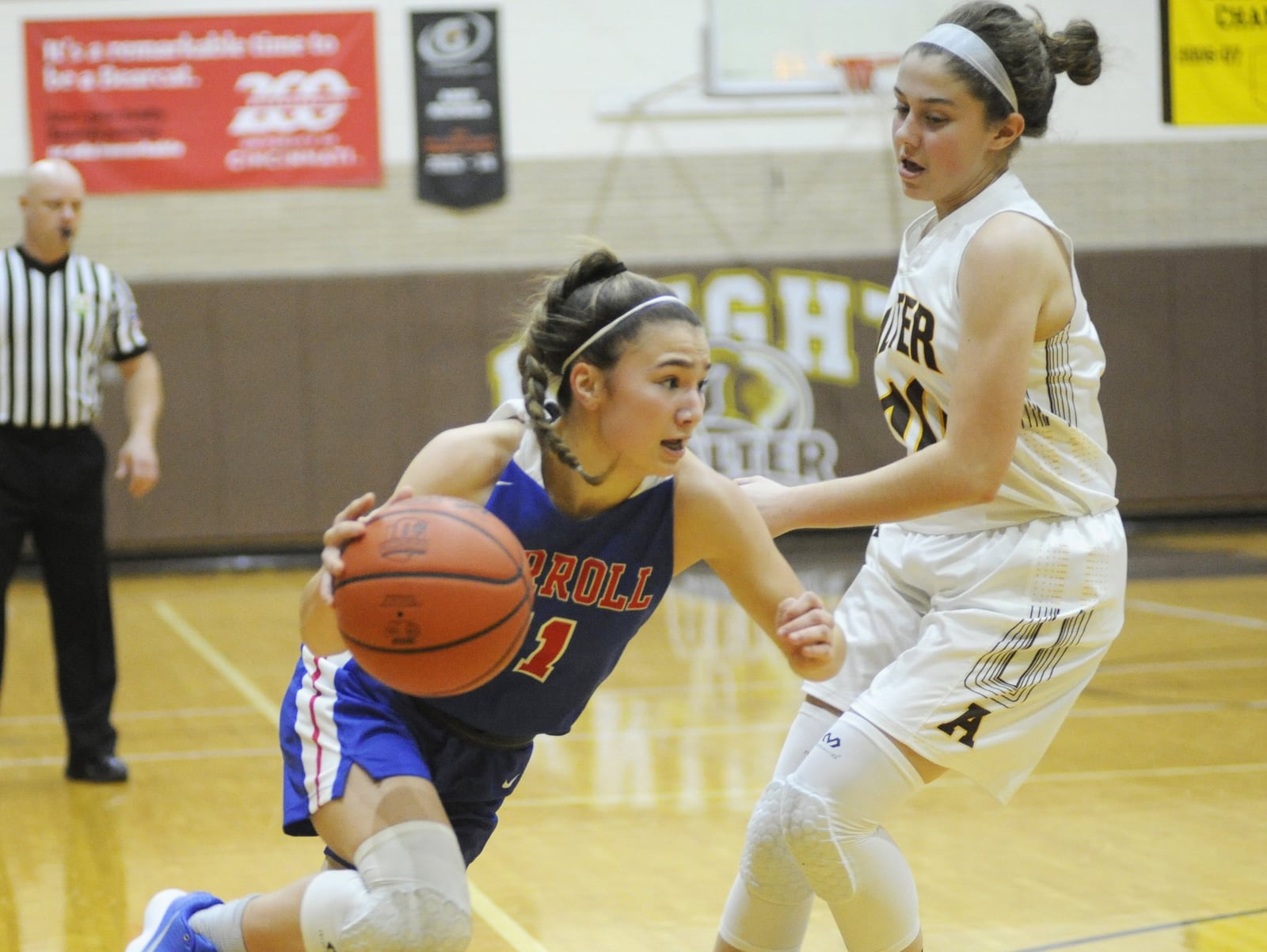 Carroll’s Ava Lickliter (left) drives on Alter’s Caraline Kernan. Carroll will play Minster in Saturday’s Flyin’ opener. MARC PENDLETON / STAFF