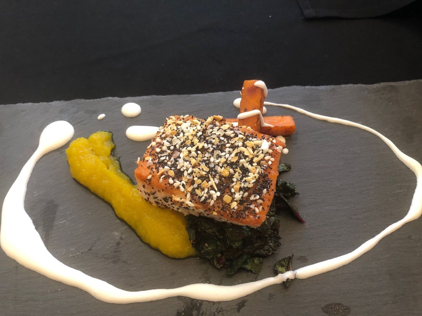 Everything Bagel-Seasoned Salmon with Yellow Beet Puree, Braised Swiss Chard, Sweet Potatoes and Greek Yogurt Cream, served by Ben Holt, executive chef of the Moraine Country Club, at the March of Dimes Signature Chef Event on Oct. 7, 2019.