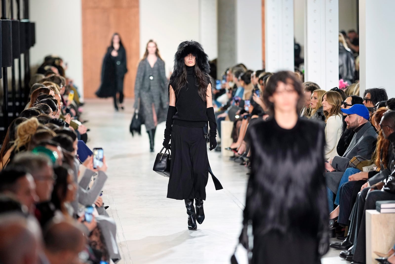 Models walk the runway during the Michael Kors Fall/Winter 2025 fashion show as part of New York Fashion Week on Tuesday, Feb. 11, 2025, at Terminal Warehouse in New York. (Photo by Charles Sykes/Invision/AP)