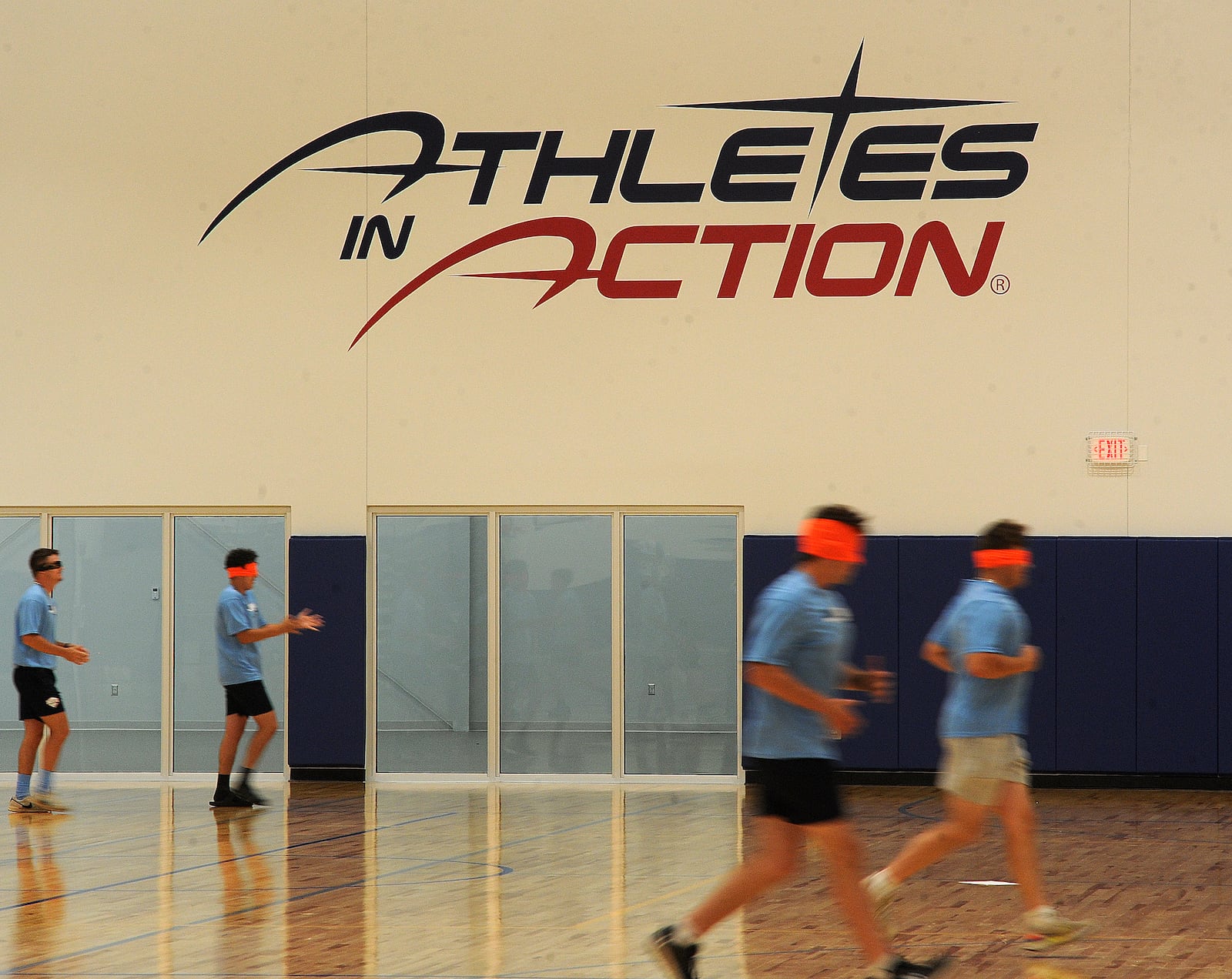 College athletes incorporate blindfolds into a training drill inside the new Wooden Family Fieldhouse at the Athletes in Action Sports Complex at 1197 S. Detroit St. in Xenia. MARSHALL GORBY\STAFF