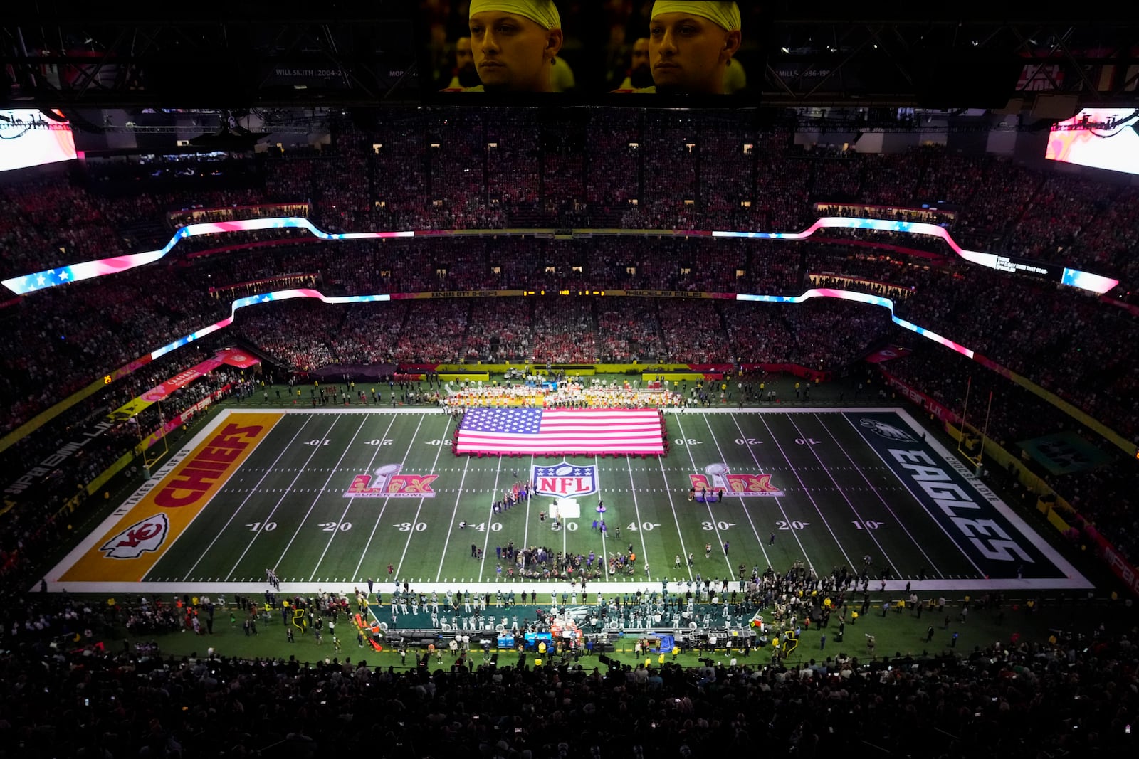 Jon Batiste performs the national anthem before the NFL Super Bowl 59 football game between the Kansas City Chiefs and the Philadelphia Eagles, Sunday, Feb. 9, 2025, in New Orleans. (AP Photo/David J. Phillip)