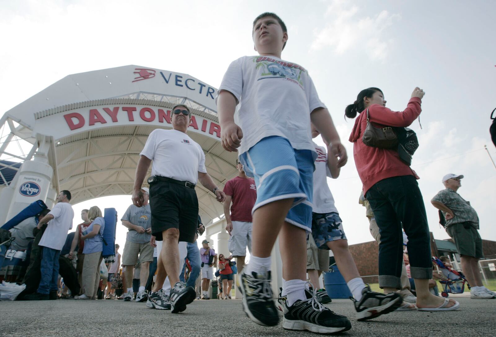 Air Show fans enjoyed touring the displays at the Vectren Dayton Air Show after coming through the main entrance. STAFF PHOTO BY TY GREENLEES