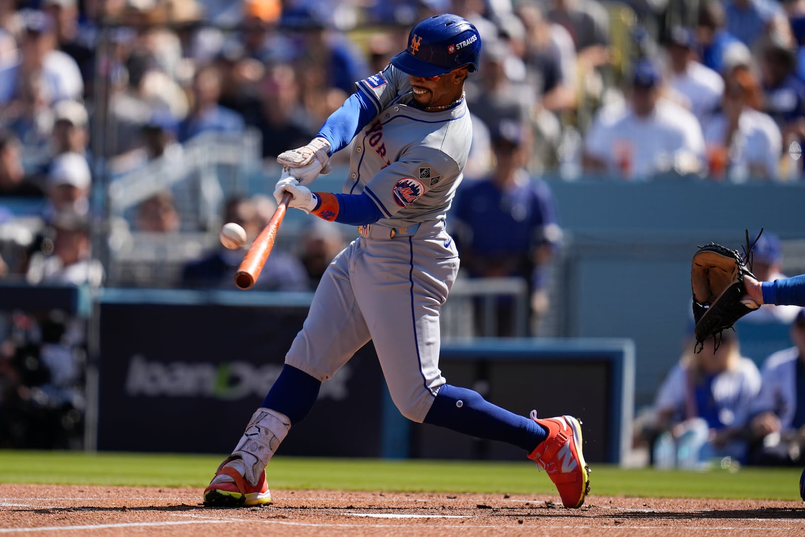 New York Mets' Francisco Lindor connects for a solo home run against the Los Angeles Dodgers during the first inning in Game 2 of a baseball NL Championship Series, Monday, Oct. 14, 2024, in Los Angeles. (AP Photo/Gregory Bull)