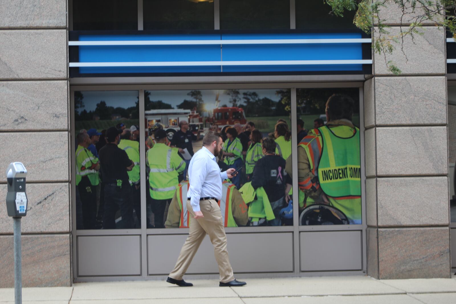 A man on his phone in downtown Dayton during the lunch hour on Monday. CORNELIUS FROLIK / STAFF