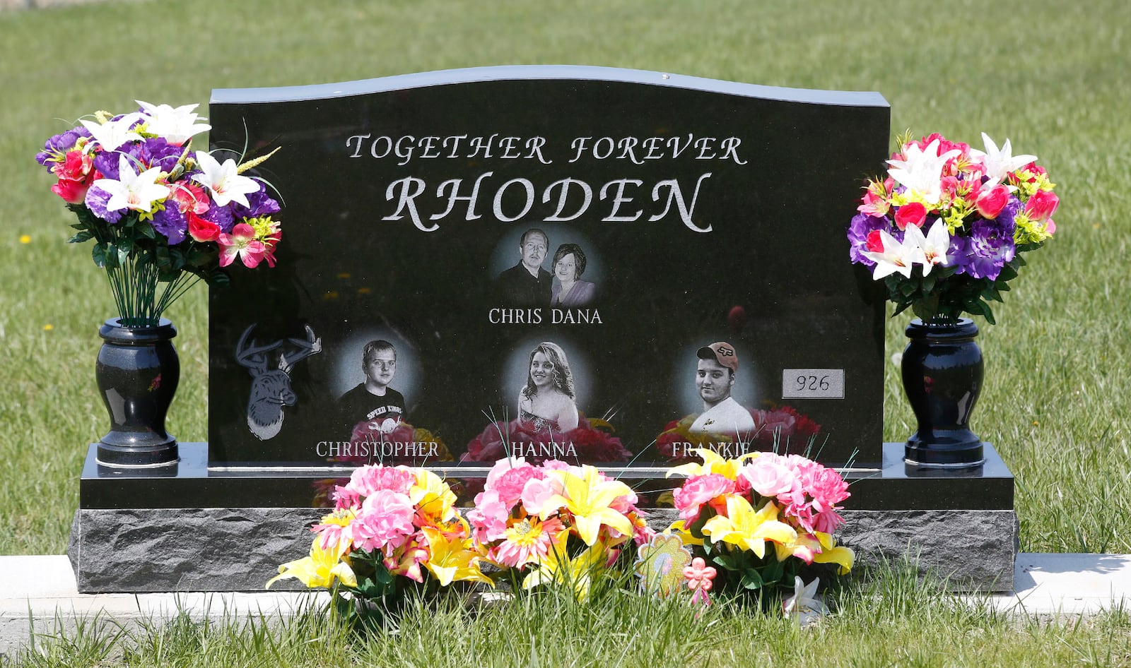 Gravesite of Rhoden family members now has a headstone after their murders in 2016.  Two years after the murder of 8 Rhoden family members in rural Pike County, the crime remains unsolved.      TY GREENLEES / STAFF