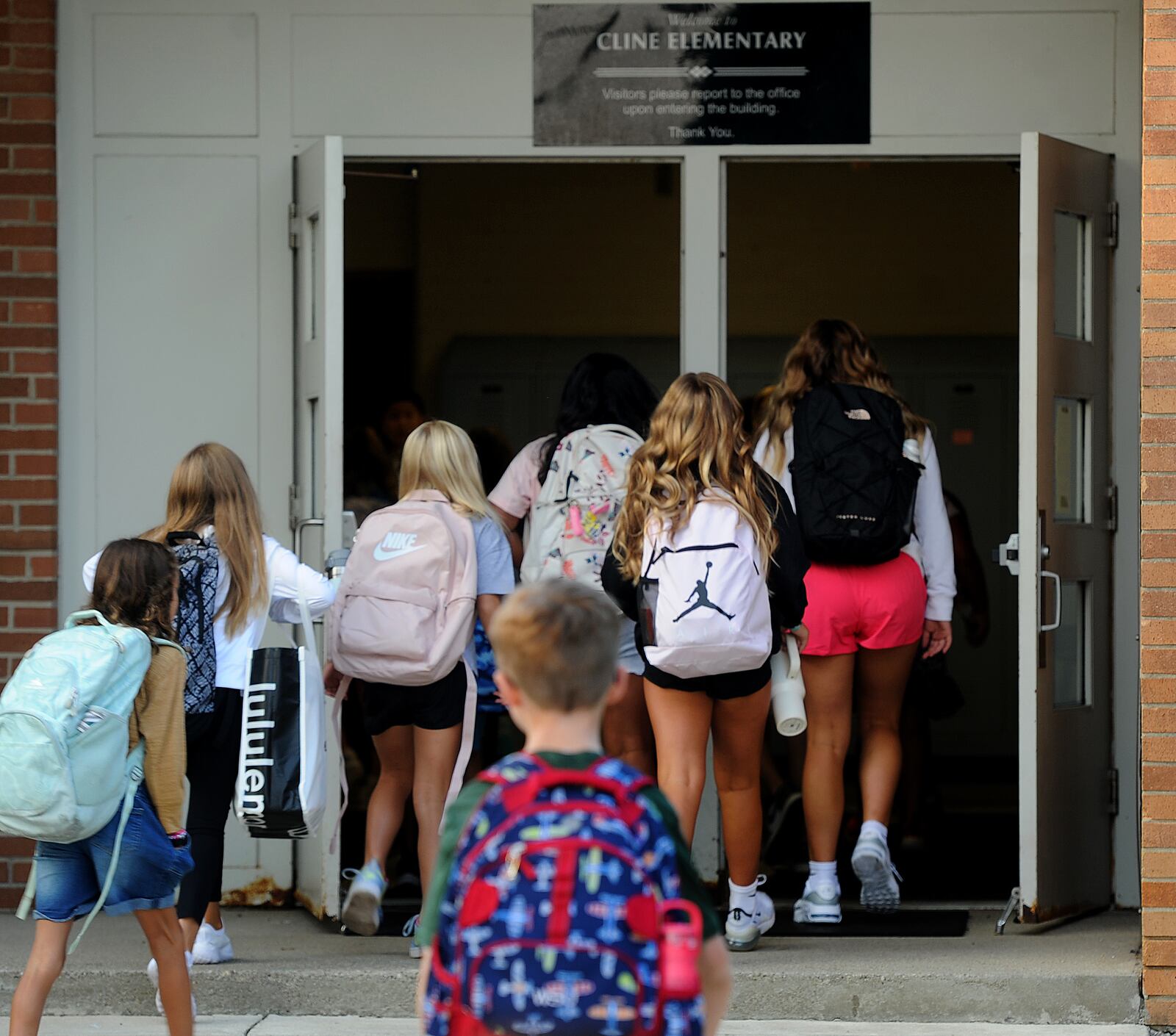 Students enter Cline Elementary in Centerville for the first day of school Wednesday, Aug. 16, 2023 . MARSHALL GORBY\STAFF