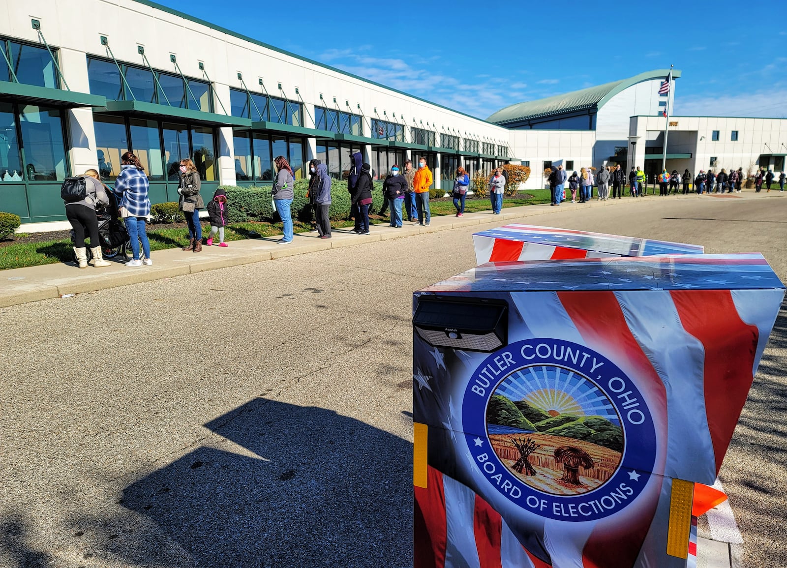 A long line forms on the last day of early voting at the Butler County Board of Elections Monday, Nov. 2, 2020 in Hamilton. NICK GRAHAM / STAFF