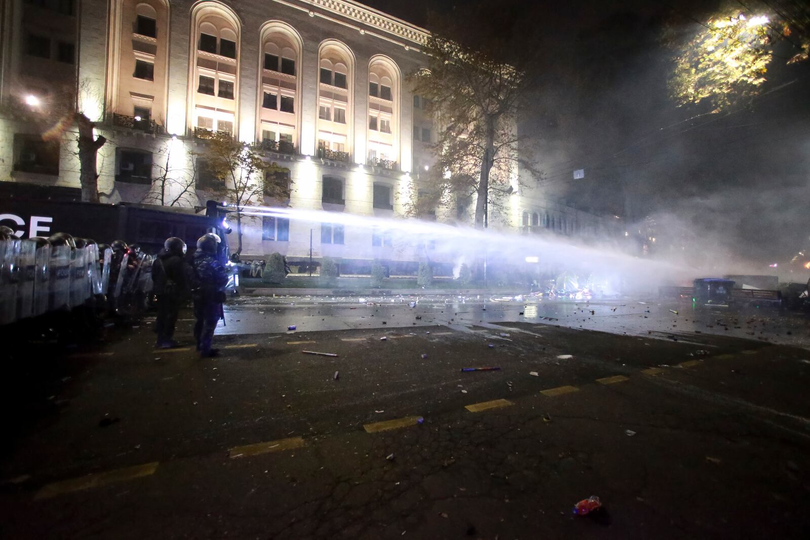 Police use a water cannon to prevent protesters rallying against the governments' decision to suspend negotiations on joining the European Union for four years, outside the parliament's building in Tbilisi, Georgia, early Saturday, Nov. 30, 2024. (AP Photo/Zurab Tsertsvadze)