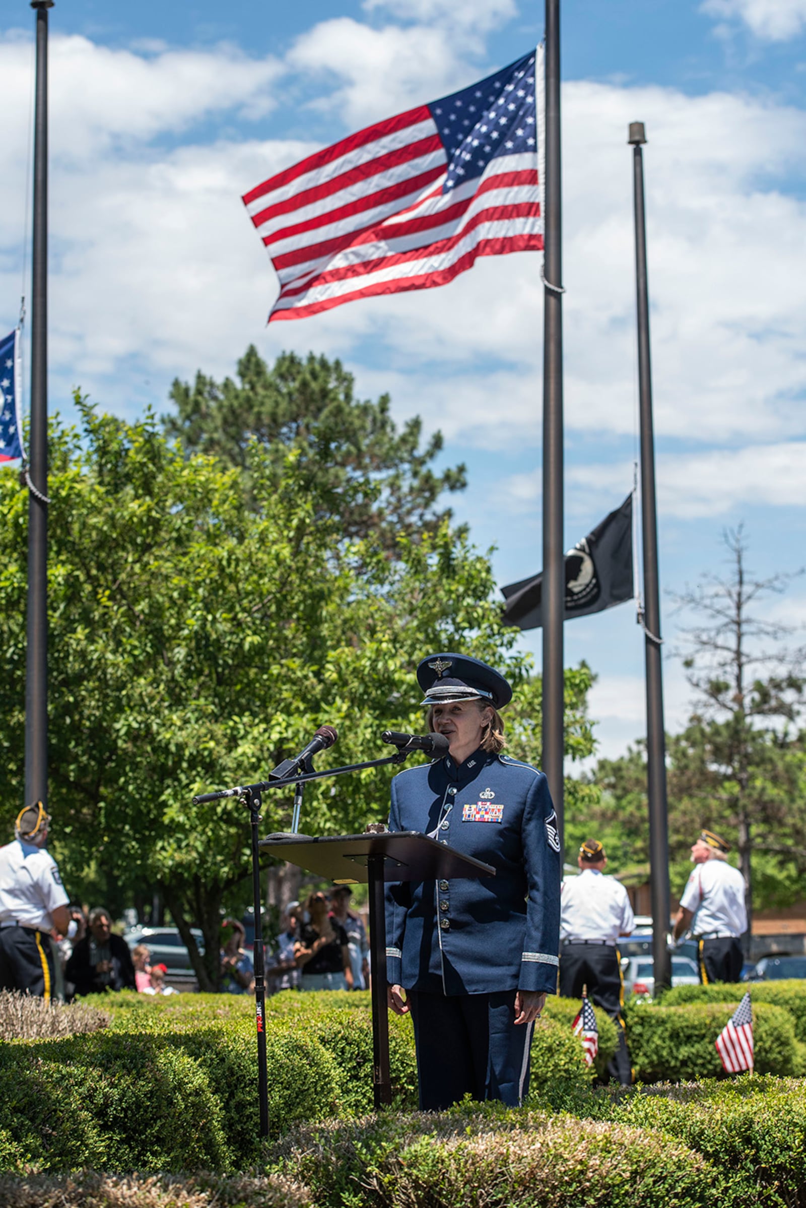 Master Sgt. Christin Foley, vocalist with the Air Force Band of Flight, sings the national anthem during a Memorial Day ceremony at the veteran’s memorial in Beavercreek May 31. Established in 1971, Memorial Day is an official federal holiday meant to allow people to honor the men and women who have died while on duty with the U.S. Military. U.S. AIR FORCE PHOTO/WESLEY FARNSWORTH