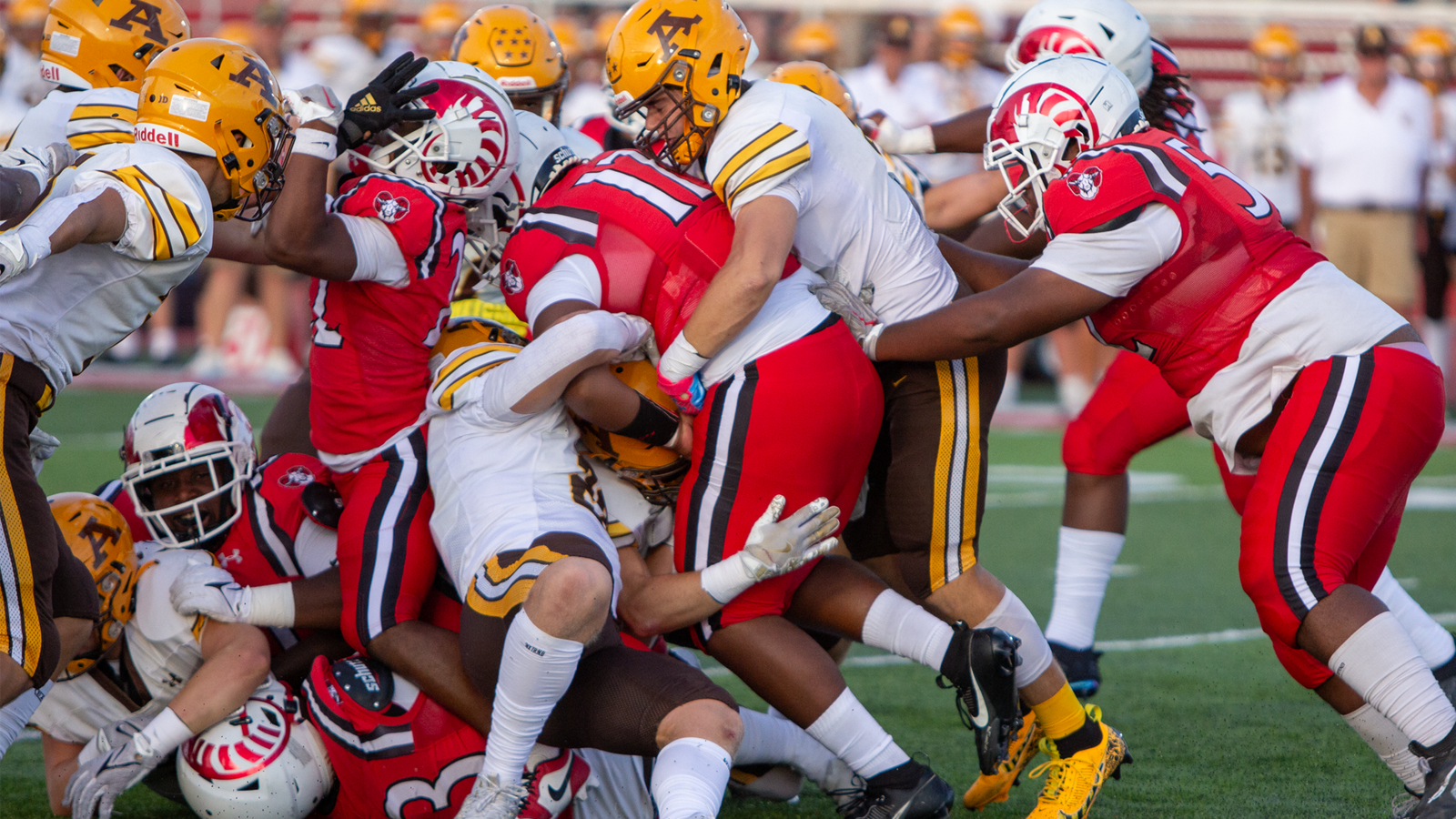 Trotwood-Madison quarterback Ke'Arron Stroud is gang tackled in Thursday night's 10-7 loss to Alter. Jeff Gilbert/CONTRIBUTED