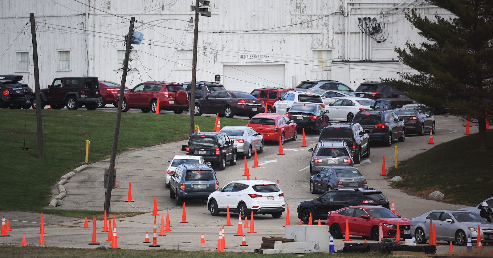 Long lines formed at the old Montgomery County Fairgrounds site in Dayton for coronavirus testing Tuesday. MARSHALL GORBY\STAFF