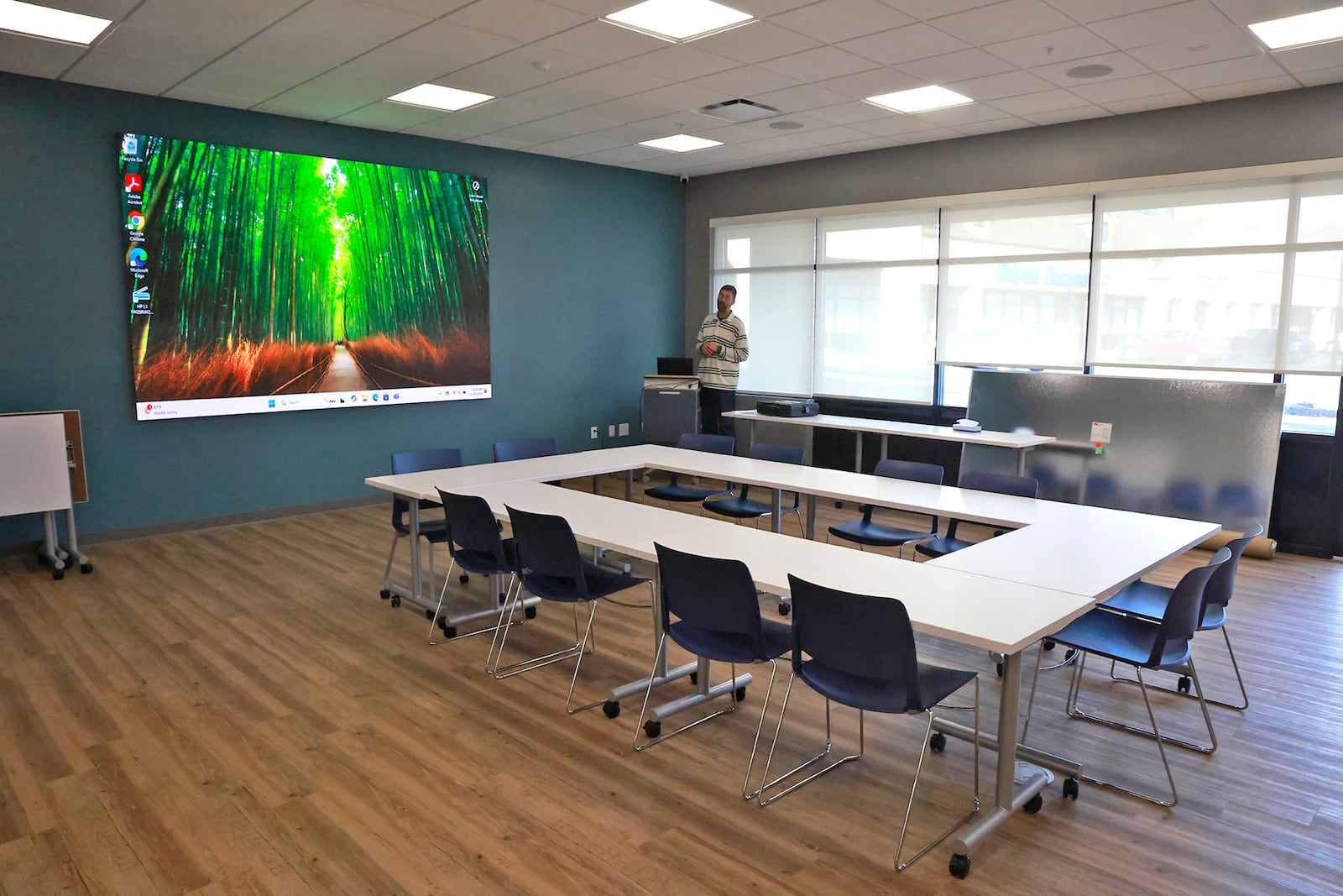 Jason Wearly, branch manager of the new Tuttle Road branch of the Clark County Library, demonstrates the video board in the library's conference room Tuesday, Nov. 26, 2024. BILL LACKEY/STAFF