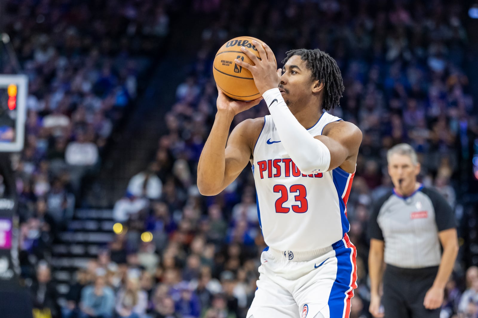 Detroit Pistons guard Jaden Ivey (23) prepares to shoot a 3-point basket during the first half of an NBA basketball game against the Sacramento Kings, Thursday, Dec. 26, 2024, in Sacramento, Calif. (AP Photo/Sara Nevis)