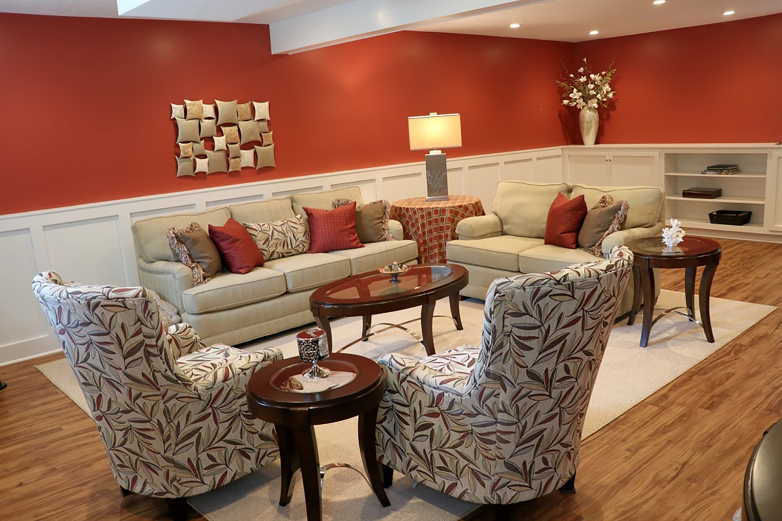 A remodeled flex-space is featured in the lower level. The space was redesigned down to the studs so additional insulation was added. Wainscoting wraps around the room and ends within a wall of built-in matching cabinets and display shelf. CONTRIBUTED PHOTO BY KATHY TYLER