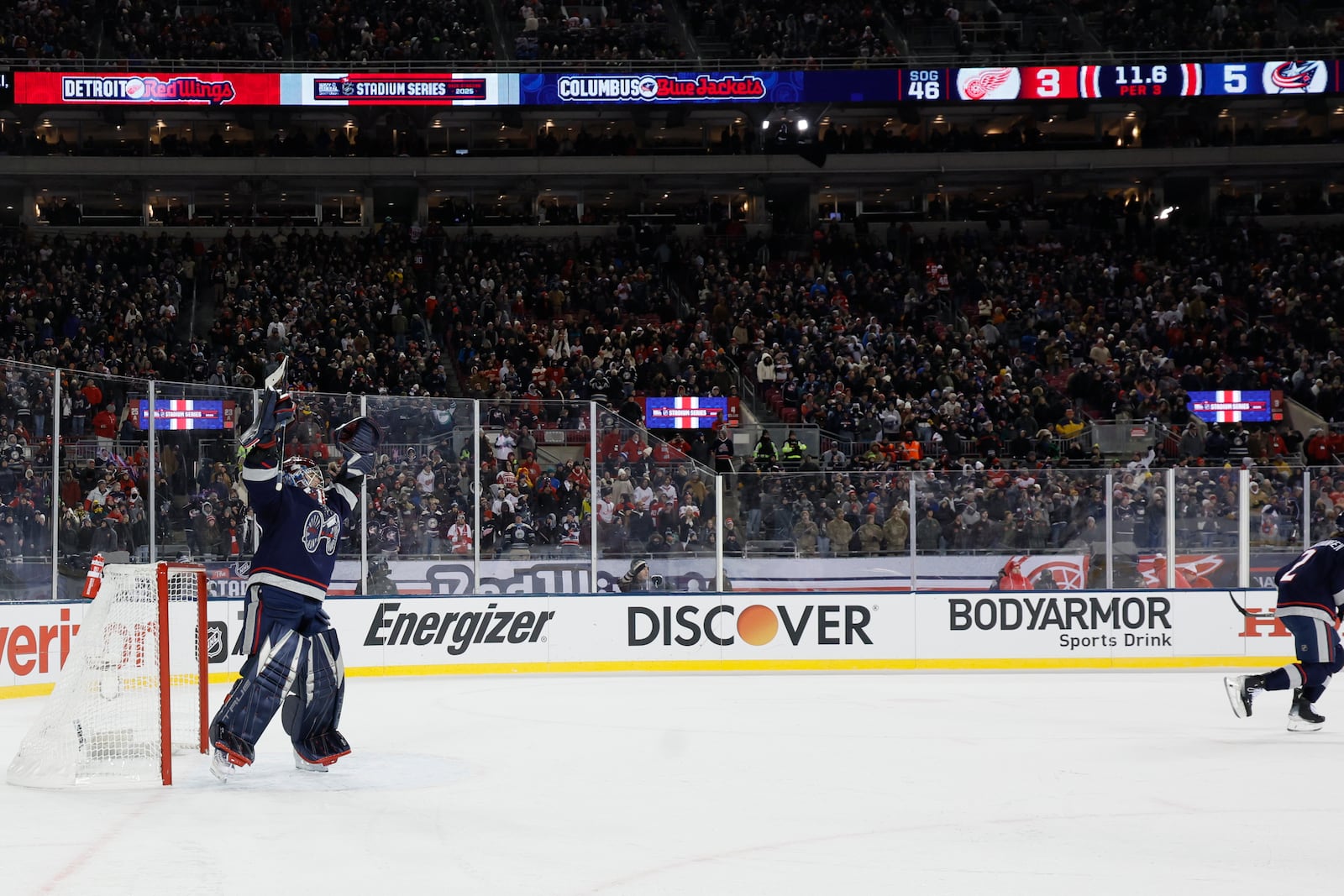 Columbus Blue Jackets' Elvis Merzlikins celebrates their goal against the Detroit Red Wings during the third period of the Stadium Series NHL hockey game at Ohio Stadium, Saturday, March 1, 2025, in Columbus, Ohio. (AP Photo/Jay LaPrete)