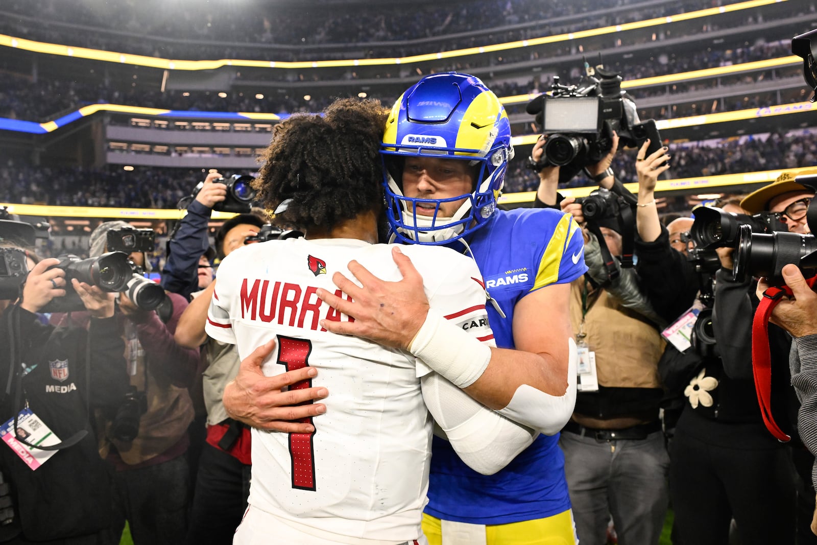 Arizona Cardinals quarterback Kyler Murray (1) hugs Los Angeles Rams quarterback Matthew Stafford after an NFL football game Saturday, Dec. 28, 2024, in Inglewood, Calif. (AP Photo/Alex Gallardo)