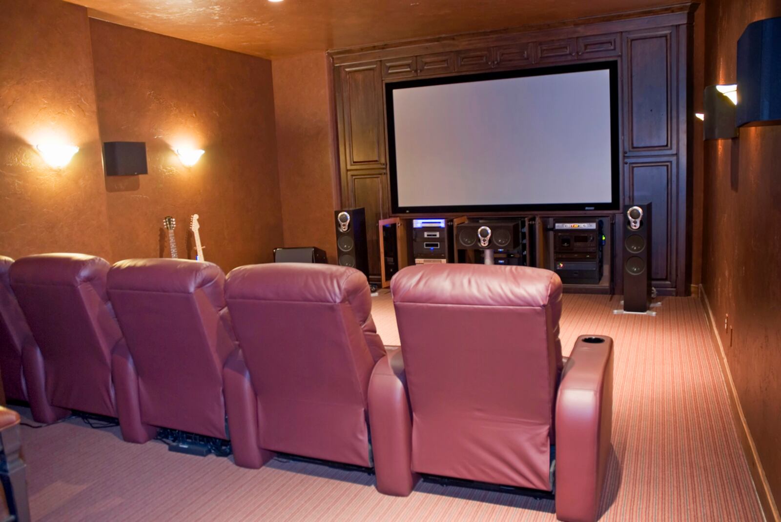 Homes with more than two people watching movies together may benefit from multiple recliners in the cinema room. Cupholders would be a plus. iSTOCK