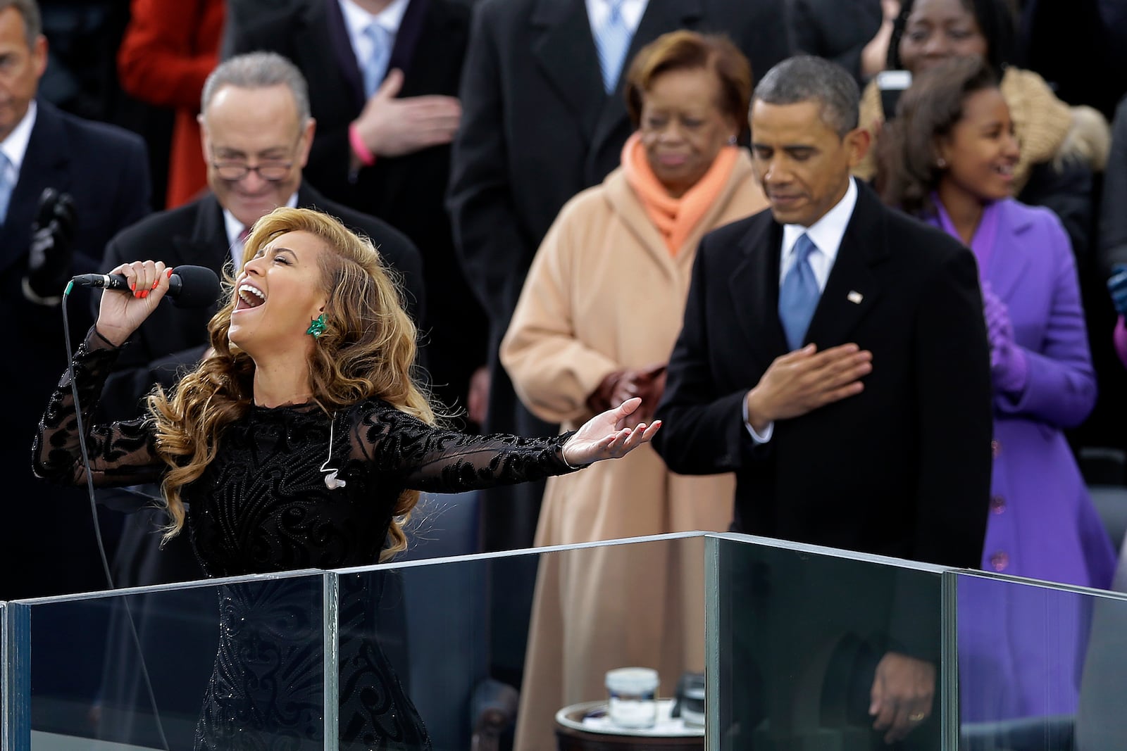 FILE - President Barack Obama bows his head as Beyoncé sings the national anthem at the ceremonial swearing-in at the U.S. Capitol during the 57th Presidential Inauguration, Jan. 21, 2013, in Washington. (AP Photo/Carolyn Kaster, File)