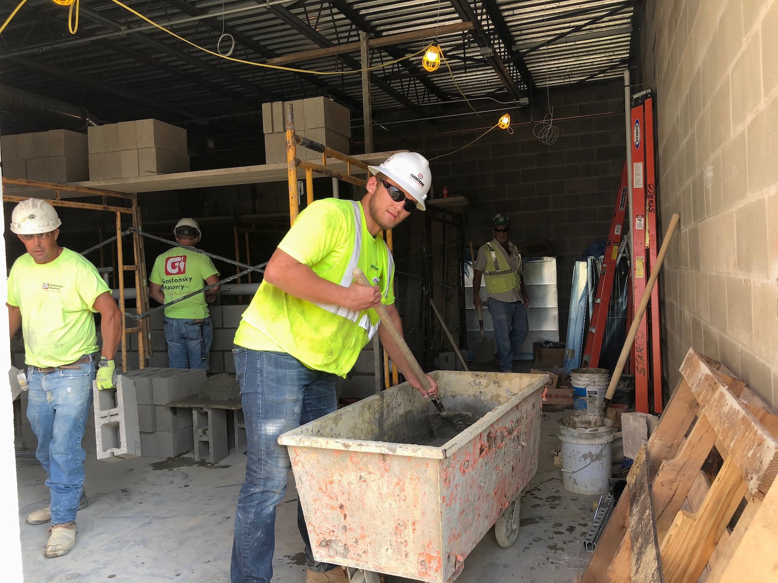 Jaeden Crowe, 17, of Kettering is a senior in Kettering Fairmont High School’s construction trades program. He is working on construction of the new high school auditorium as an apprentice for Shook Construction. LYNN HULSEY/Staff