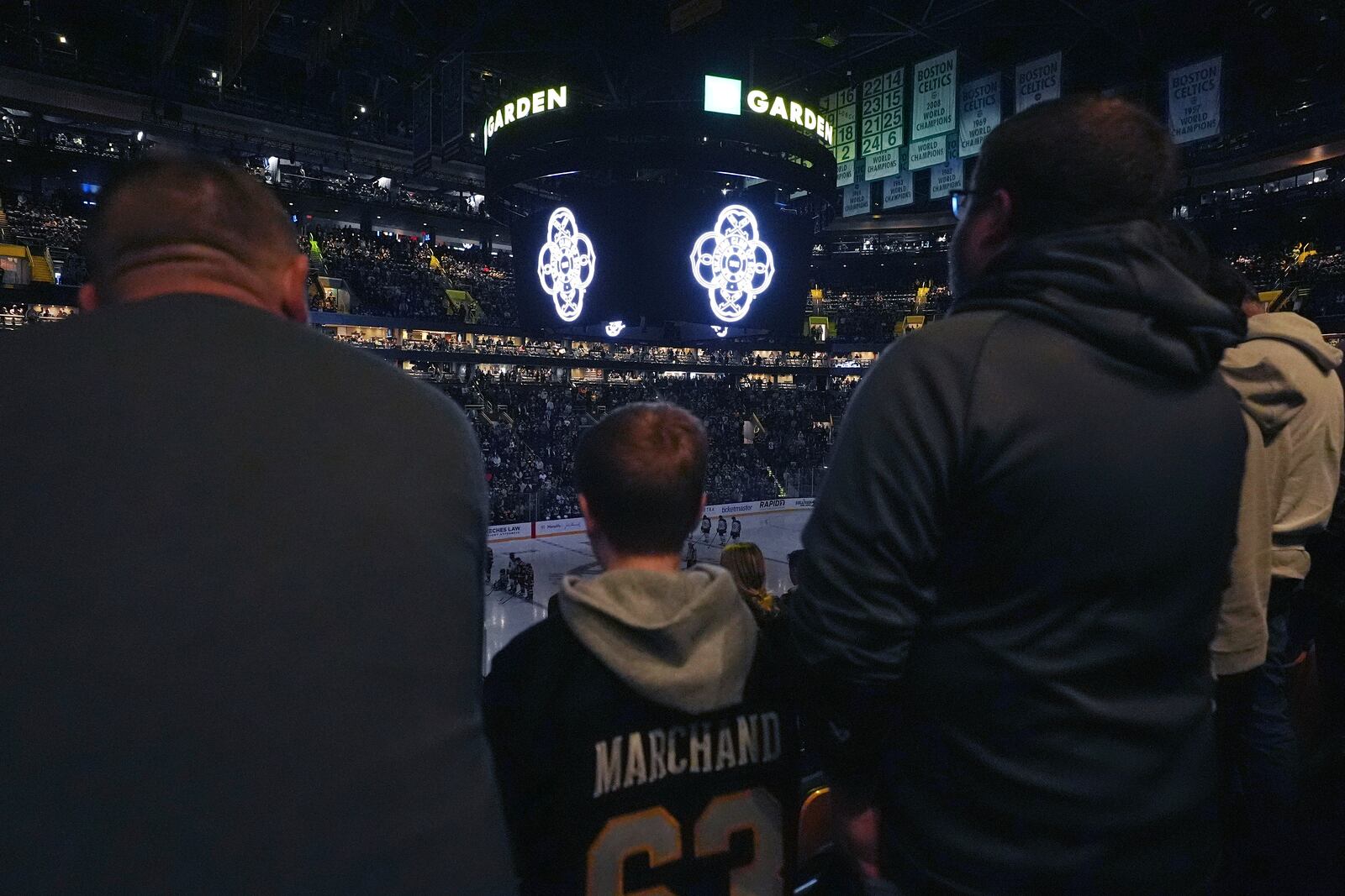 Members of the Skating Club of Boston community, athletes, coaches and family who were killed when an American Airlines flight collided with an Army helicopter Wednesday, Jan. 29, 2025, and crashed into the Potomac River in Washington, are honored prior to an NHL hockey game between the Boston Bruins and Winnipeg Jets, Thursday, Jan. 30, in Boston. (AP Photo/Charles Krupa)