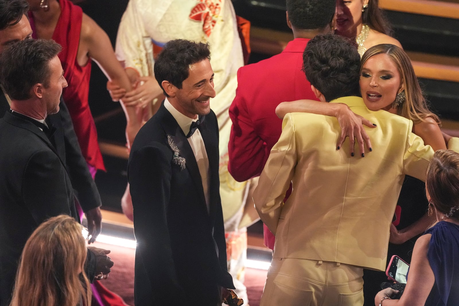 Adrien Brody, from left, Timothee Chalamet, and Georgina Chapman in the audience during the Oscars on Sunday, March 2, 2025, at the Dolby Theatre in Los Angeles. (AP Photo/Chris Pizzello)