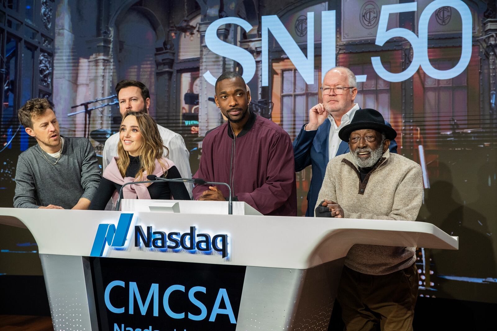 Mark Marshall, second right, chairman of Global Advertising & Partnerships, NBCUniversal, and current and veteran members of the SNL cast, celebrate the SNL IPO as they ring the Nasdaq opening bell, in New York's Times Square, Friday, Feb. 14, 2025. (AP Photo/Eduardo Munoz Alvarez)