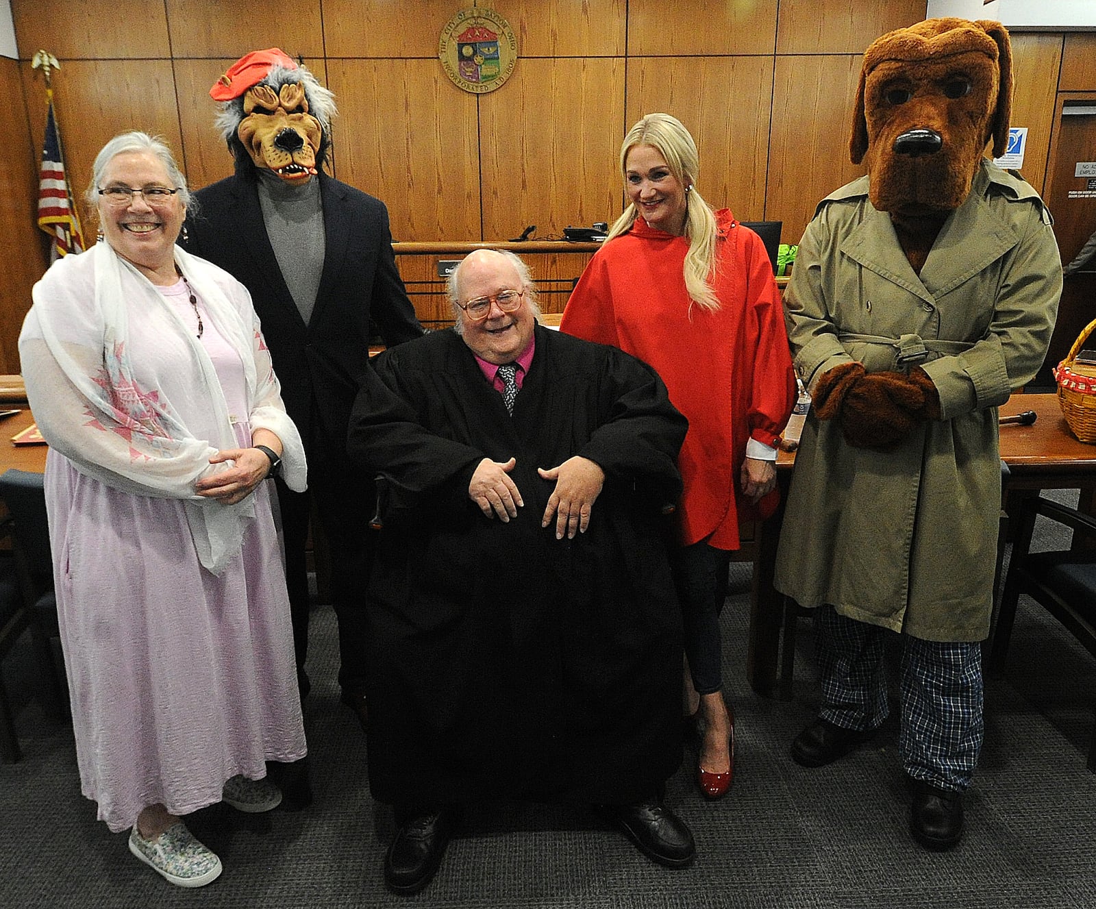 Judge Daniel Gehres held his last high-profile trial Friday, May 12, 2023: The State of Ohio v. Big Bad Wolf in Dayton Municipal Court. Gehres has been holding Big Bad Wolf trials for more than 35 years. The prosecution will allege that the Big Bad Wolf ate all of Little Red Riding Hood’s cookies. The defense will argue that the wolf is innocent of all charges. The student jury was only the second to convict the Big Bad Wolf. From the left, Grandma - Virginia Platt Gehres, Big Bad Wolf - Chuck Taylor, Judge Daniel Gehres, Litte Red Riding Hood - Katie Bligh and McGruff - Dayton police officer Eric Miller. MARSHALL GORBY\STAFF