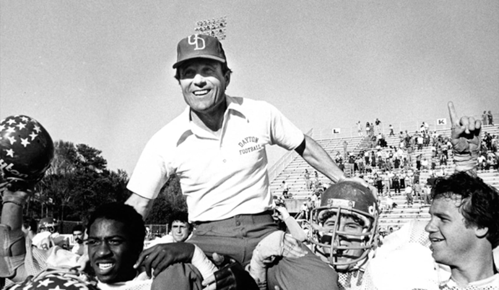 Dayton players carry head coach Rick Carter off the field after the Flyers won the Division III national championship game. University of Dayton photo